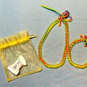 Sheer orange and yellow beaded 2-piece sets for teens or young adults.